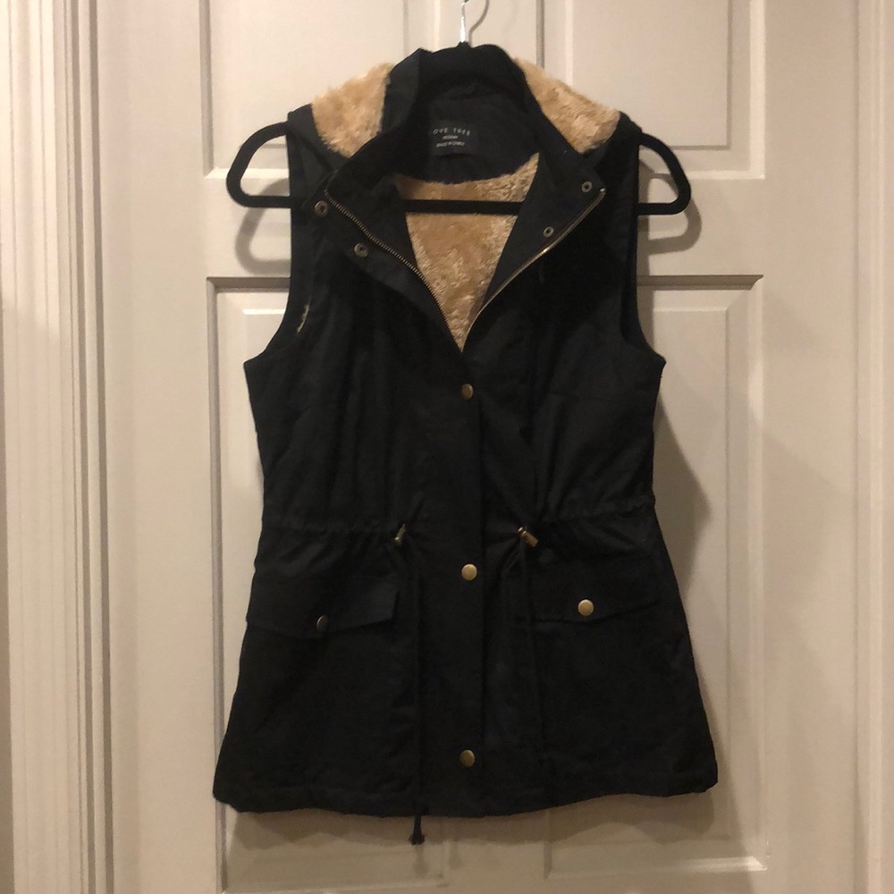 Fur lined vest with detachable hood
